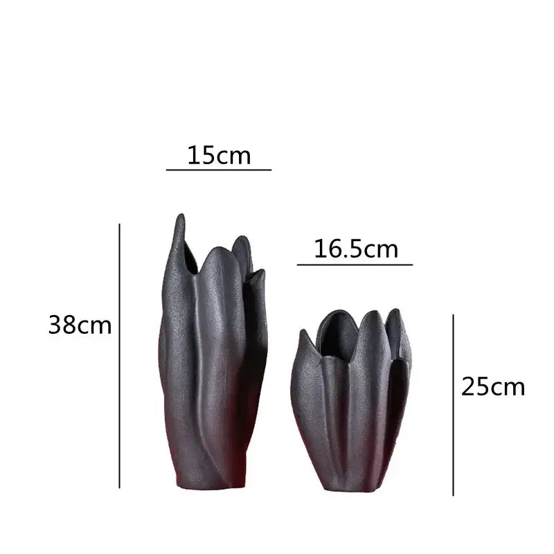 Two black texture ceramic vases with sculpted petal design and matte finish perfect for living room decor by decorbites