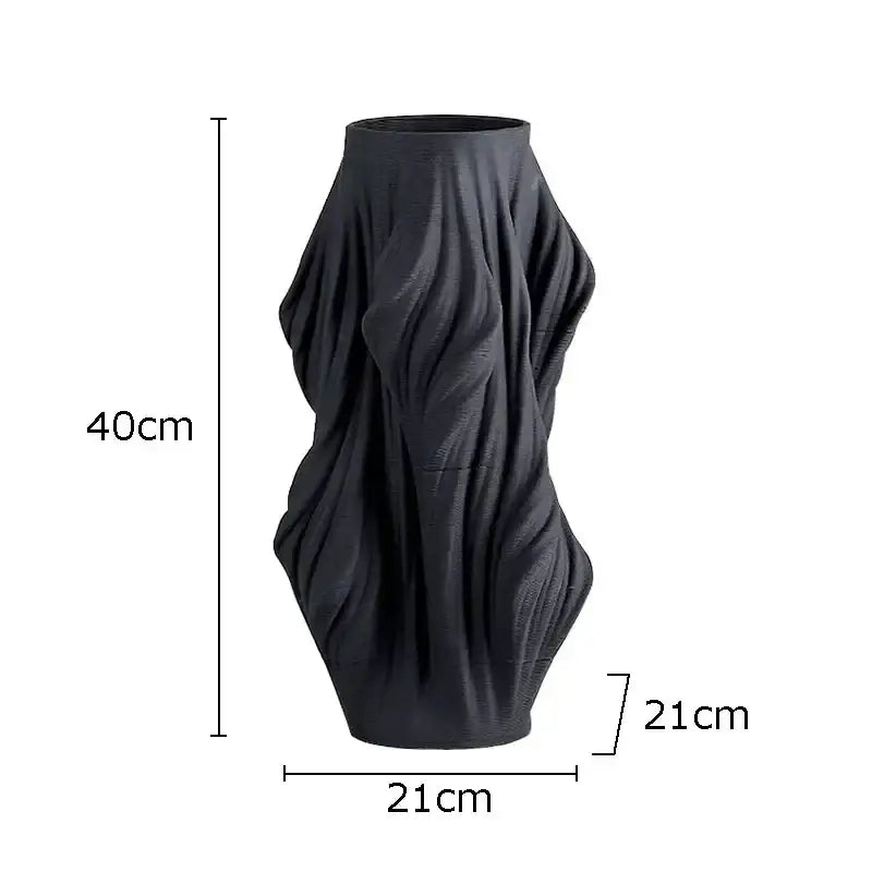 Black ceramic vase with sculpted flowing ribbed texture from decorbites ceramic vase set for bedroom decor