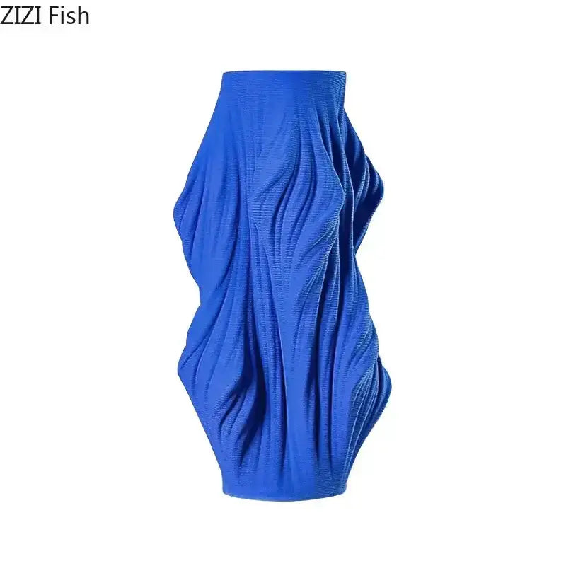Vibrant cobalt blue textured knit midi skirt with sculpted draped silhouette featured with decorbites ceramic vase set for bedroom decor