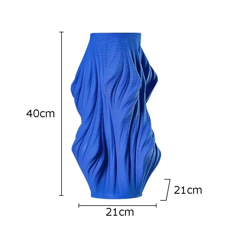 A vibrant blue decorbites ceramic vase with sculpted flowing ribbed texture for bedroom decorbites ceramic vase set