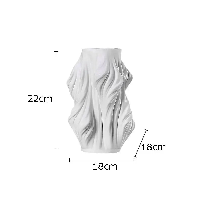 White sculpted ceramic vase with flowing fabric design and purple flowers for bedroom decor by decorbites ceramic vase