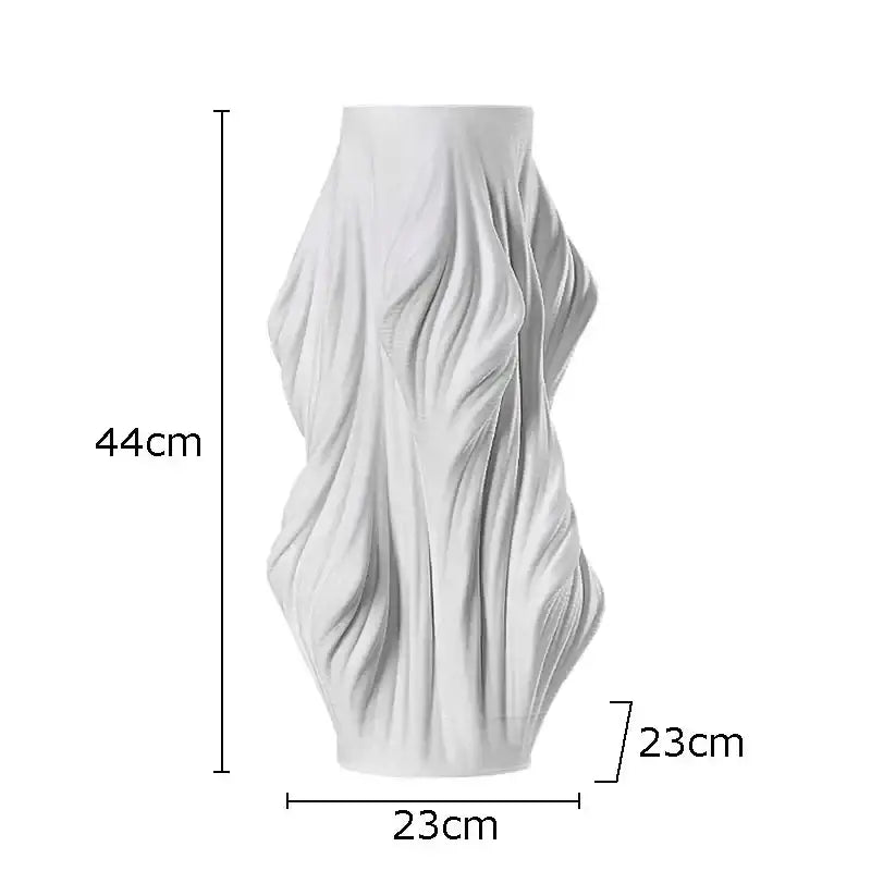 Sculpted white ceramic vase with flowing fabric design and purple flowers for bedroom decor by decorbites ceramic vase