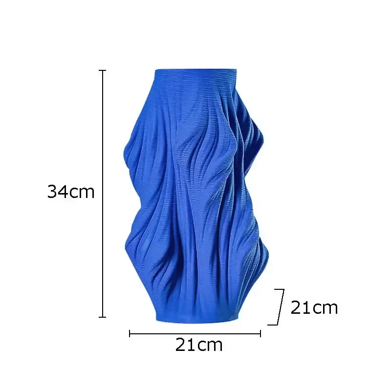 Vibrant blue decorbites ceramic vase with textured sculpted surface resembling flowing fabric for bedroom decor