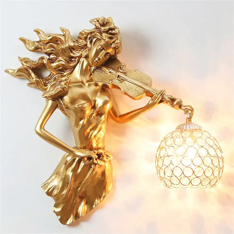 Sculptural gold violinist crystal wall lamp with flowing hair and ornate crystal globe shade for living room sconce
