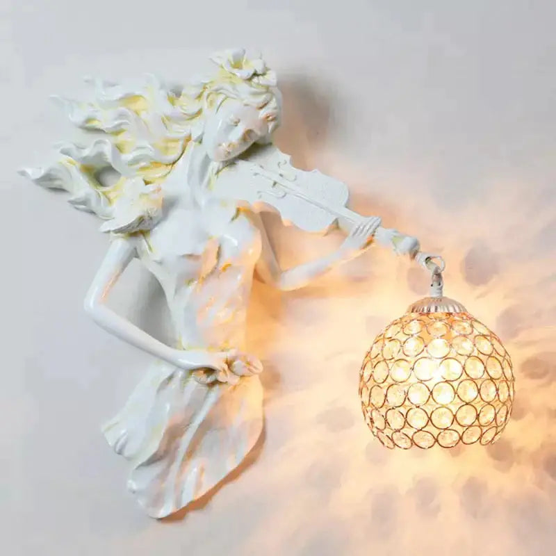 White ceramic wall lamp featuring a sculpted violinist with flowing hair and an ornate spherical crystal wall lampshade
