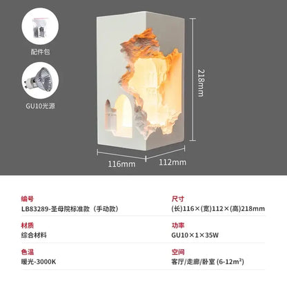 A modern rectangular wall sconce with white exterior and glowing orange rock embedded night light for corridor use