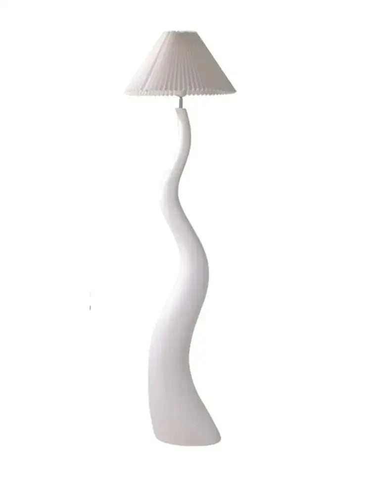 A sleek white floor lamp with a flowing cream resin base and pleated shade perfect for living room lighting