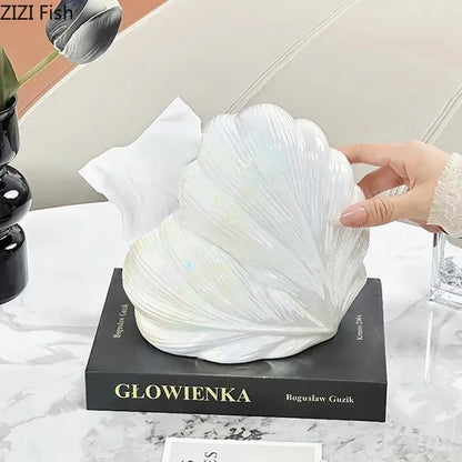 A glossy white ceramic seashell tissue box with detailed ridged texture for decorbites heart feather ceramic decor
