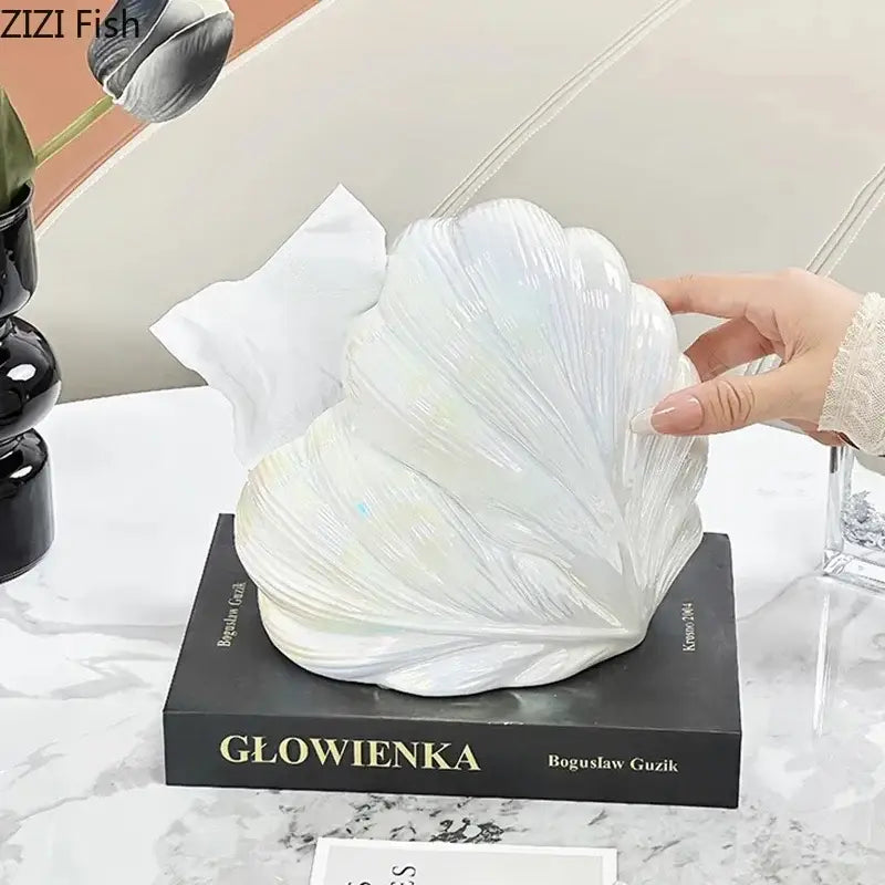A glossy white ceramic seashell tissue box with detailed ridged texture for decorbites heart feather ceramic decor
