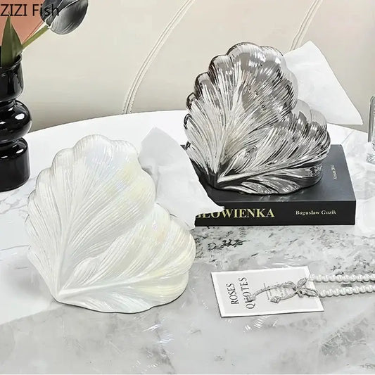 Two seashell shaped tissue box holders in translucent white and metallic silver for decorbites heart feather ceramic decor