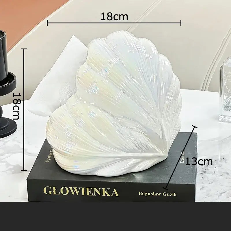 Glossy white ceramic seashell tissue box with iridescent highlights and ridged texture for decorbites heart feather decor