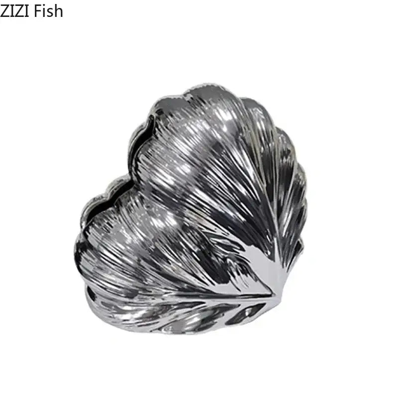 Shiny silver shell-shaped heart feather ceramic tissue box with intricate ridged texture for decorbites decor