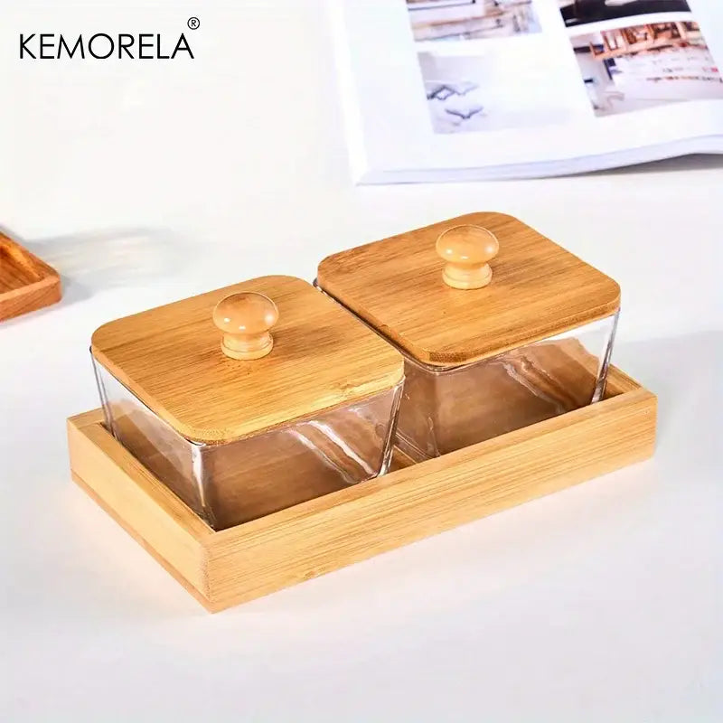 Kemorela bamboo tray holding two clear glass snack jars with bamboo wood lids and round wooden knobs