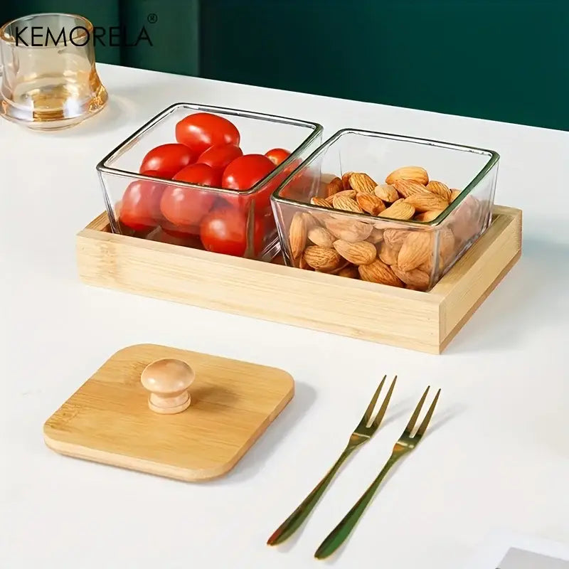 Set of 3 clear glass kitchen snack jars with bamboo wood lid and tray holding cherry tomatoes and almonds