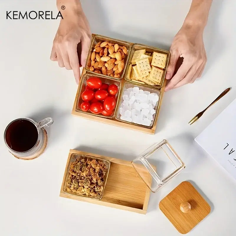 Gold-finished bamboo wood snack tray with four clear glass compartments holding almonds crackers tomatoes and ice cubes