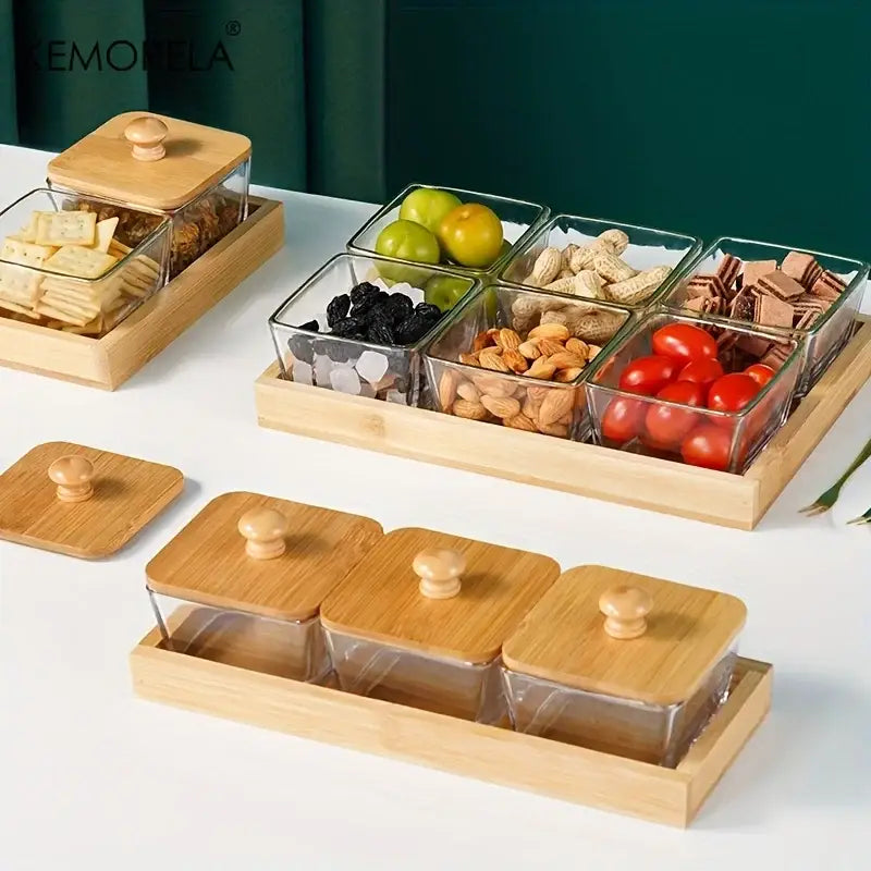 Set of three clear glass snack containers with bamboo wood lids and wooden trays for kitchen storage
