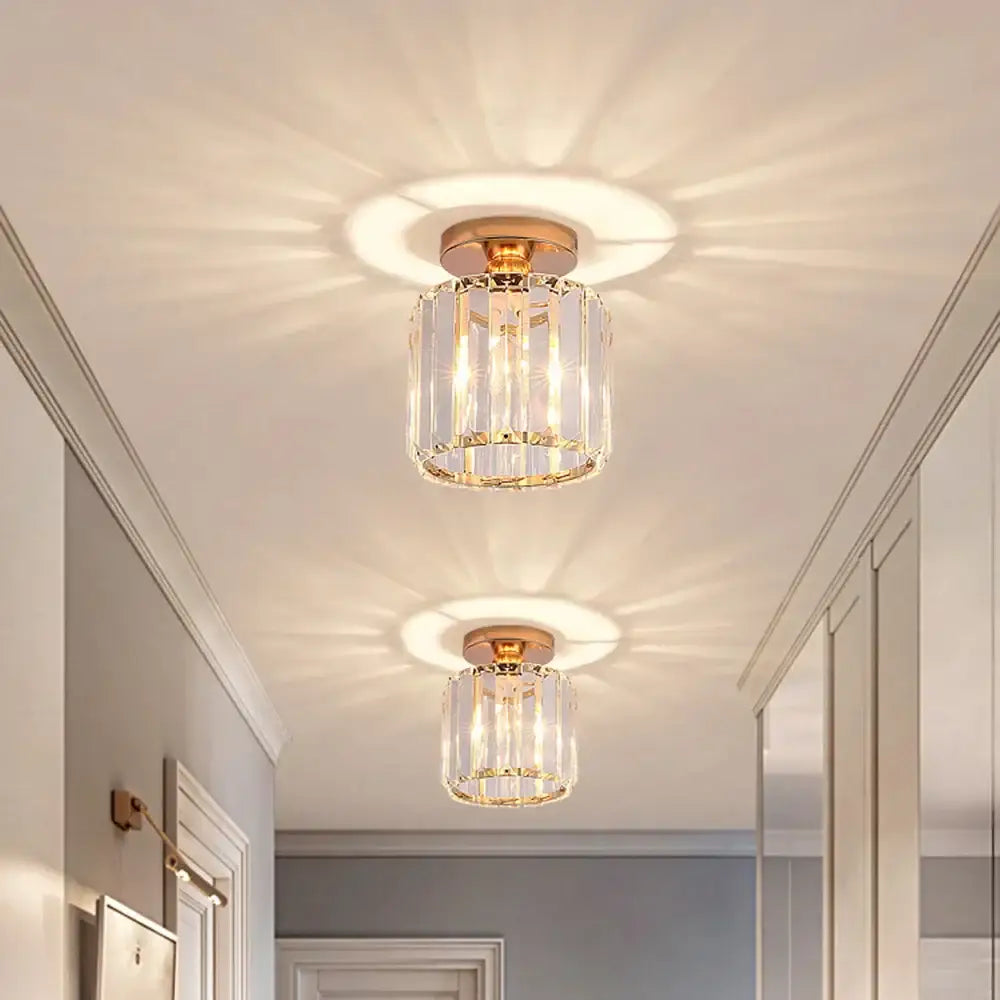 Gold-toned crystal mini ceiling light with vertical faceted glass rods and circular brass base for decorbites ceiling lights