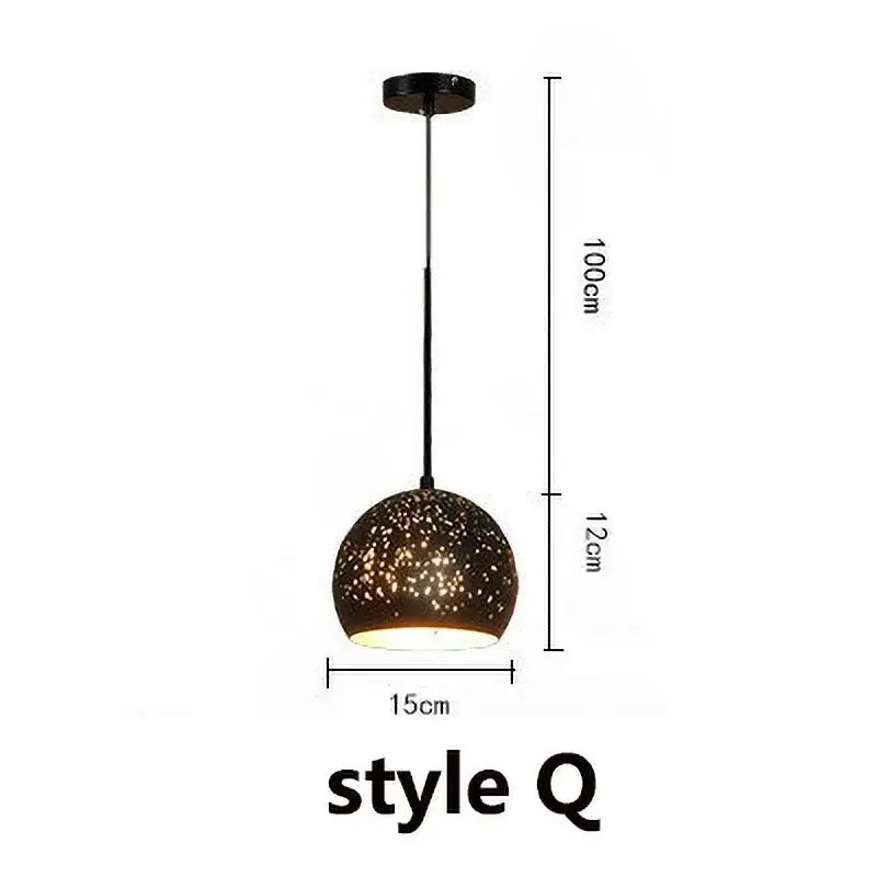 Set of 4 black and gold etched iron pendant light fixtures with sleek black pendant light and speckled glass shade