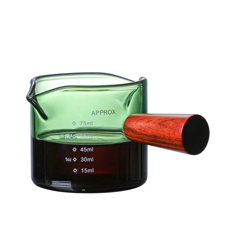 Green glass measuring cup with polished wooden handle and clear volume markings from decorbites glass double set