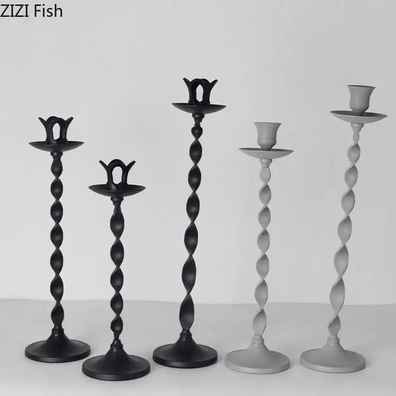 Set of five elegant twisted metal candlestick holders in black and gray featuring ornate tops for decorbites golden candlestick decor