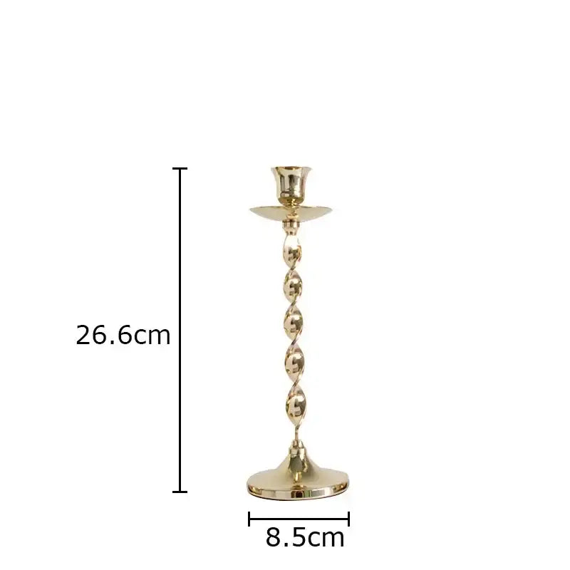 A tall slender golden candlestick holder with a twisted spiral metal design and flared base from decorbites set of 4