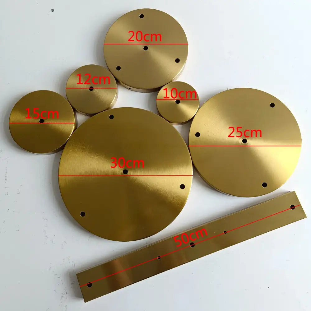 Set of 6 brushed brass ceiling plate lamp bases with circular and rectangular drill holes in varying sizes for diy use
