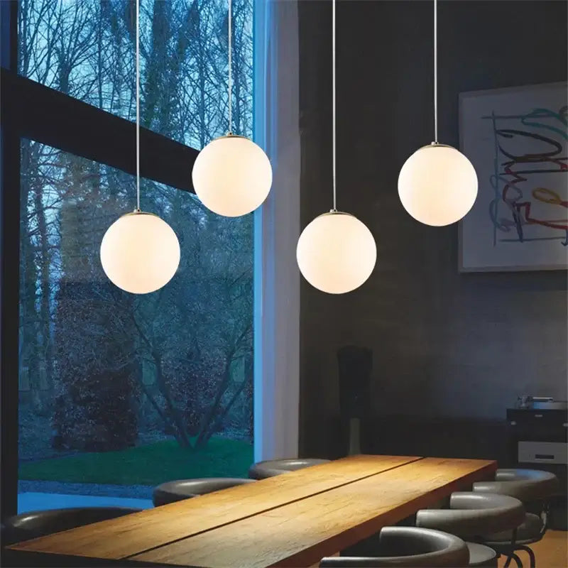 Set of six frosted glass ball pendant lights with spherical design hanging from metallic cords for living room decorbites glass ball pendant