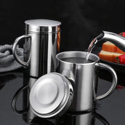 Shiny stainless steel double wall coffee mug with matching lid and handle designed for hot beverage travel use