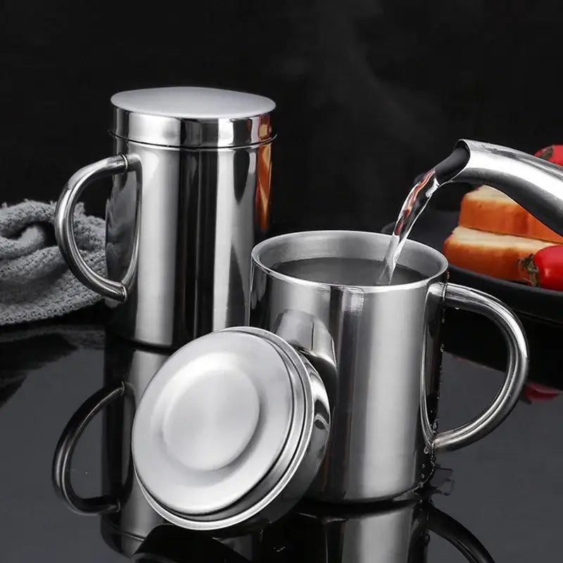 Shiny stainless steel double wall coffee mug with matching lid and handle designed for hot beverage travel use