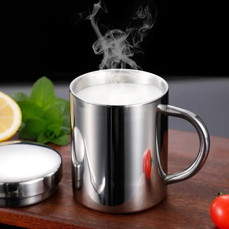 Shiny stainless steel double wall coffee mug with sleek reflective surface and sturdy handle for travel use