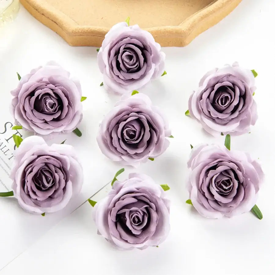 Lavender synthetic roses with layered petals and small stems in silk blue artificial flowers for wedding decor