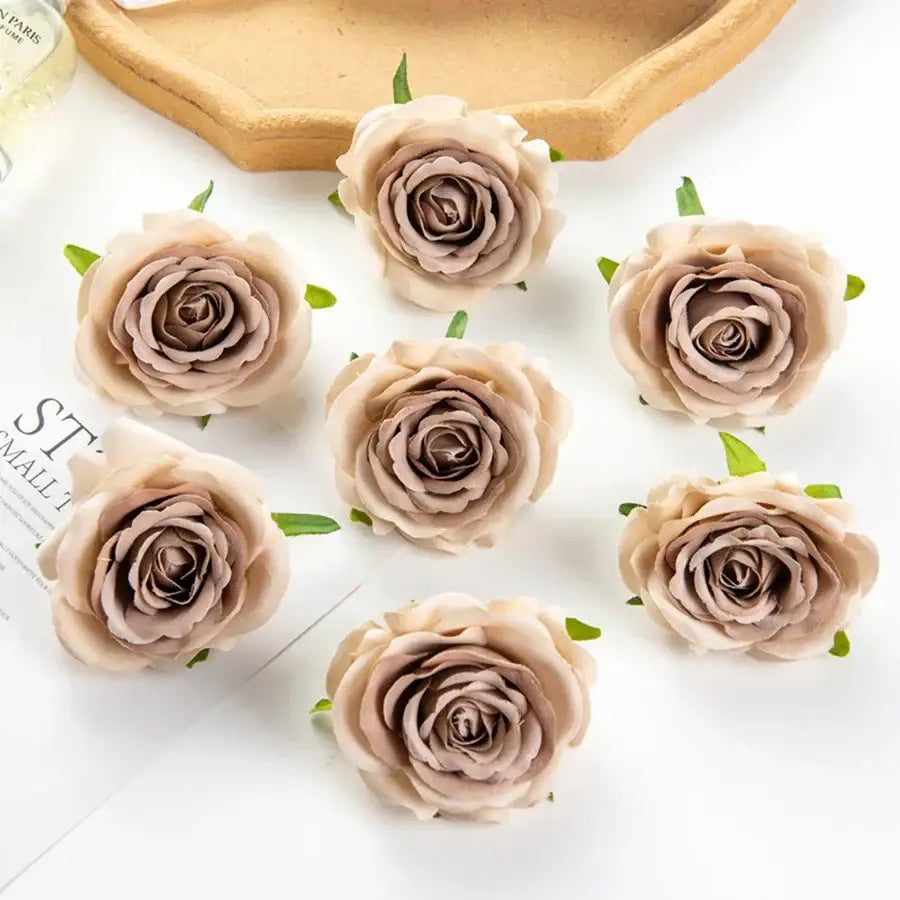 Beige artificial roses with delicate layered petals and green leaves for silk blue rose wedding party decor