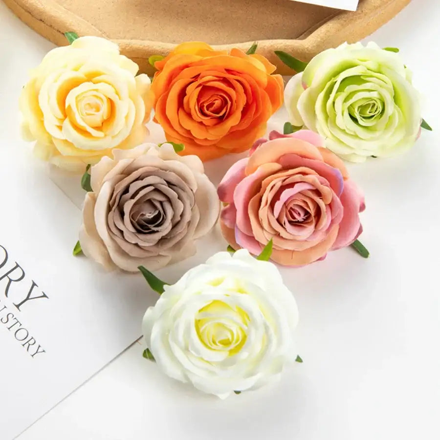A collection of silk blue artificial flowers and roses in pastel and vibrant hues made from smooth lifelike fabric for decor