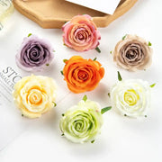 A collection of silk blue artificial flowers featuring fabric roses in pastel and vibrant hues with delicate green stems for decor