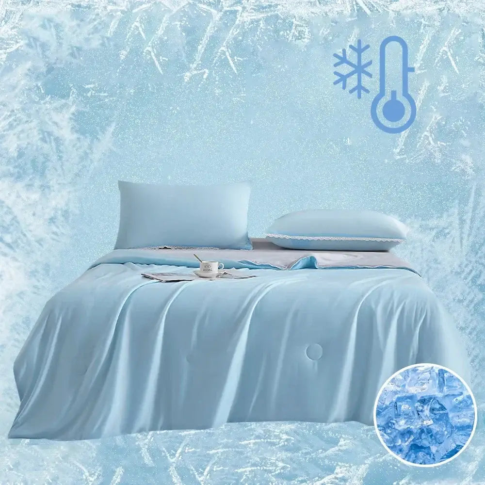 Light blue cooling queen quilt with smooth satin fabric and subtle quilted detailing for summer comfort
