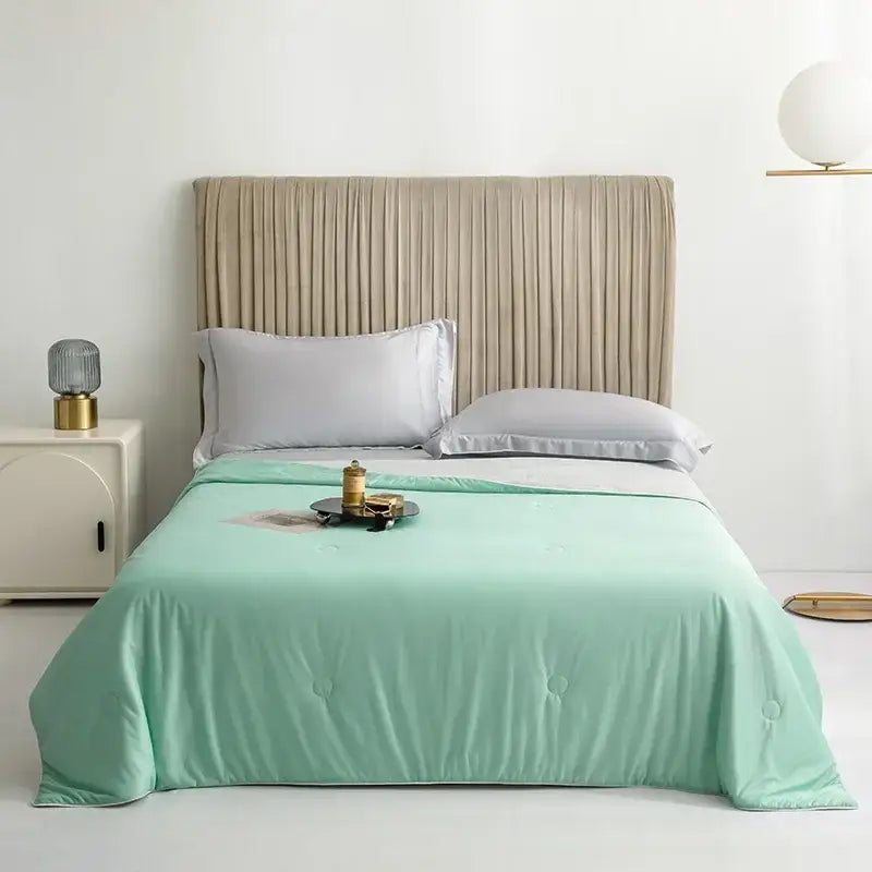 Mint green quilted bedspread with subtle tufting details for silky light blue cooling queen quilt summer comforter
