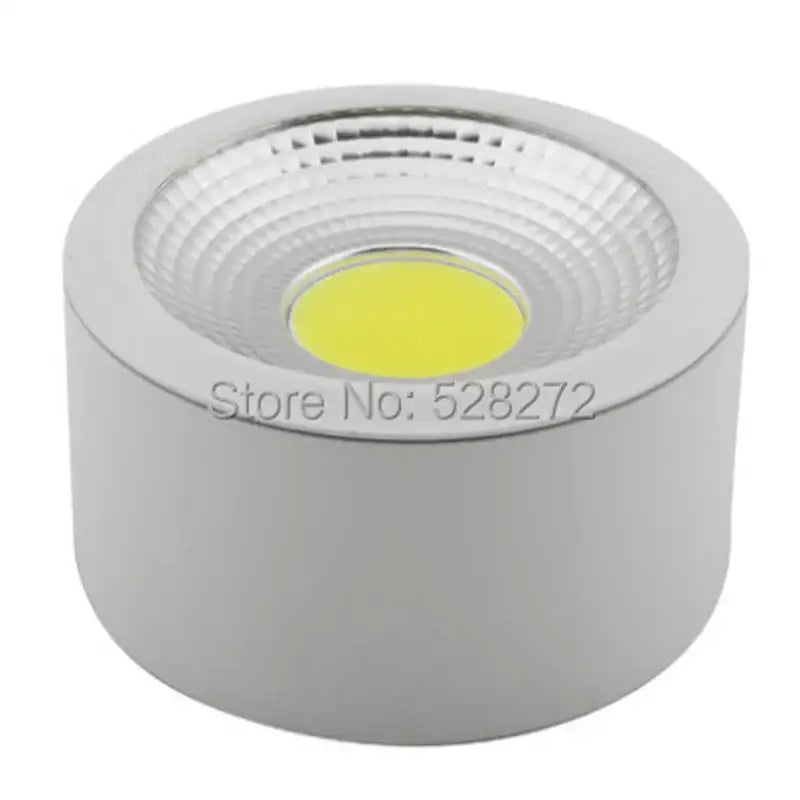 Silver cylindrical 15w cob led downlight with textured circular lens and bright yellow light for decorative lighting