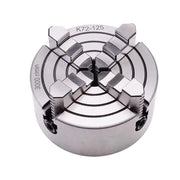 Silver 4 jaw metal lathe chuck decorbites 125mm with circular design and four angular jaws for workshop use