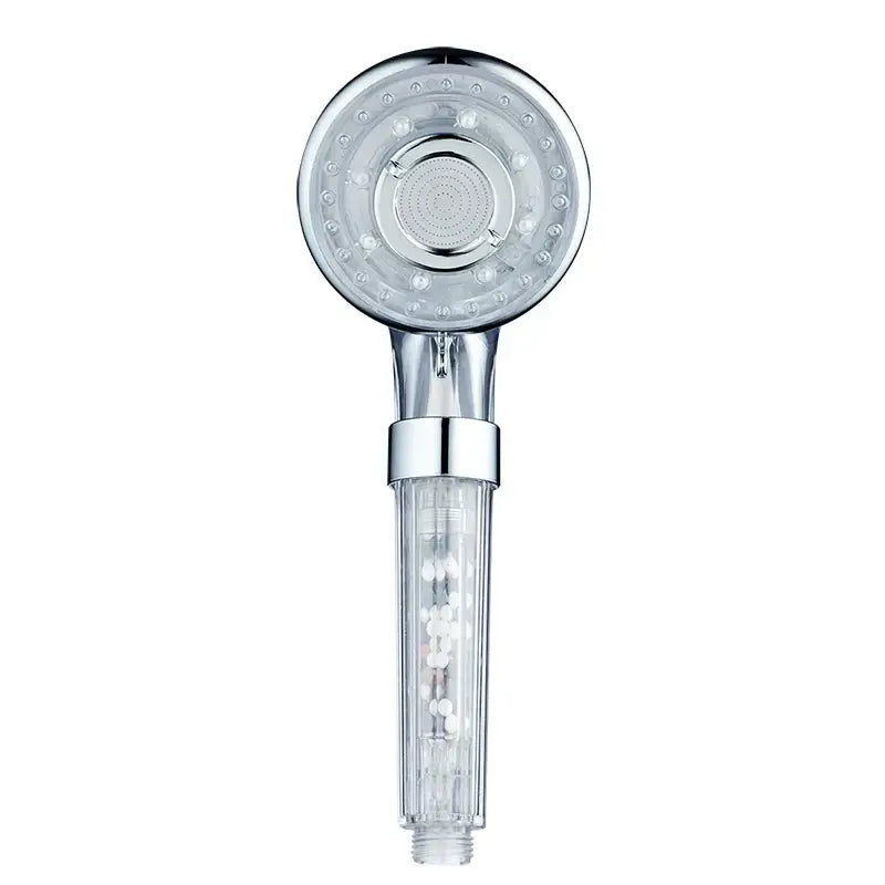 Silver and clear chrome finished high pressure shower head with circular nozzles and visible internal filter chamber