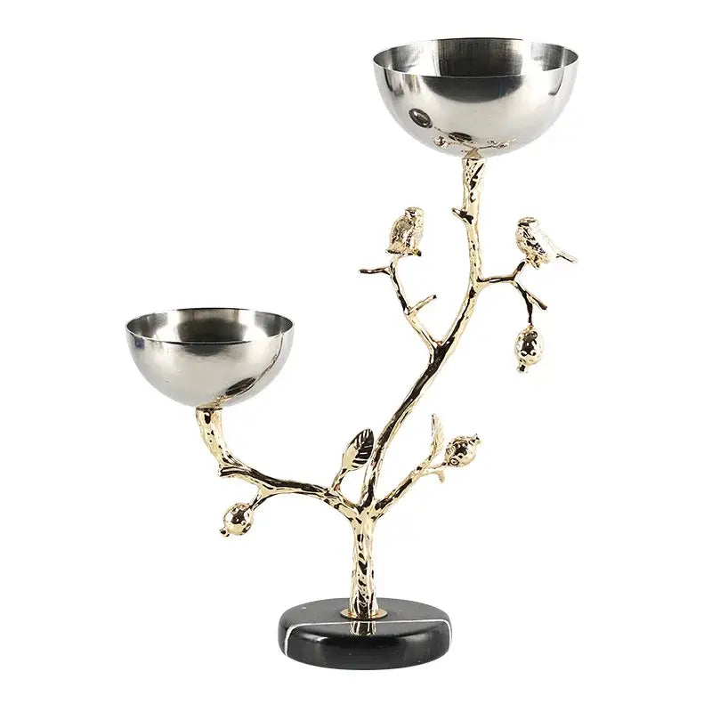 Silver and gold metal snack bowl stand with tree branch design, bird figurines, and polished silver bowls for dining room fruit