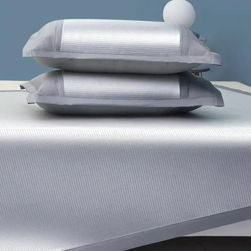 Silver and gray antibacterial cooling sheet with silver ribbed pillowcases and matching textured bedspread by decorbites cooling sheet