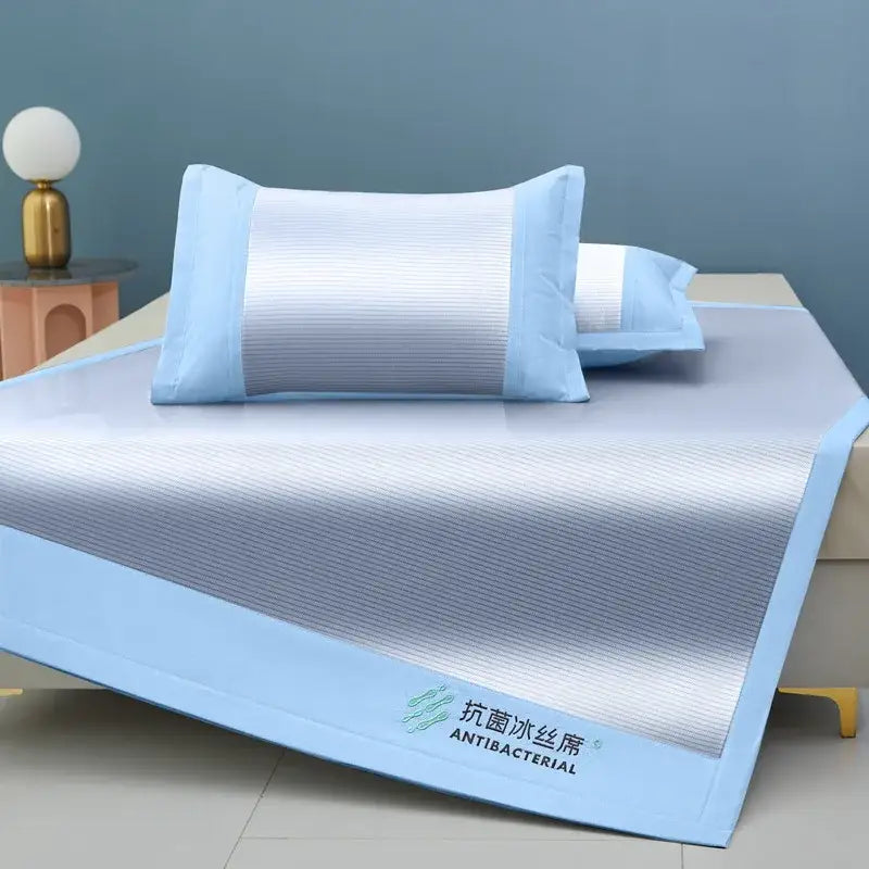 Light blue antibacterial cooling sheet with textured stripes and embroidered decorbites branding for bedroom use