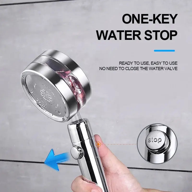 Shiny chrome-finished shower head with single-button water stop feature in a silver and purple double panel turbo design