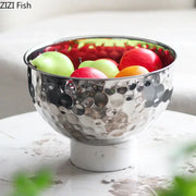 Silver hammered metal fruits bowl with hammer pattern and white marble pedestal base for dining room use