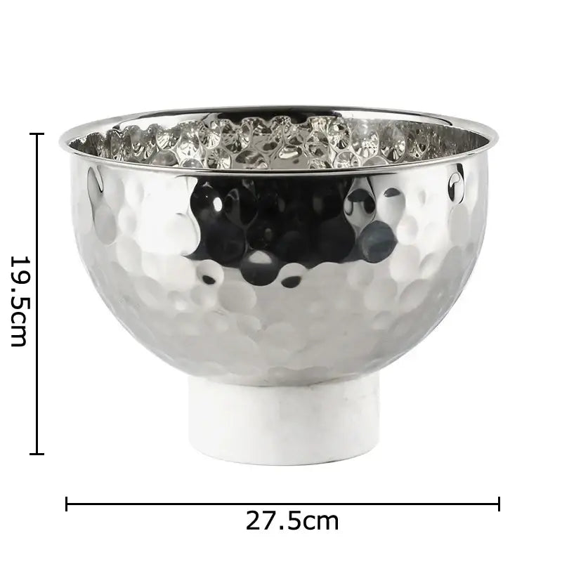 Silver and white hammer pattern fruits bowl with hammered silver metal and white marble pedestal base for dining room