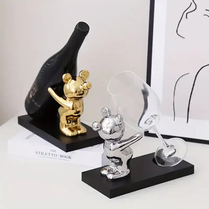 Gold and silver mickey mouse bear wine rack figurines holding wine bottles and glasses on black bases for kitchen decor