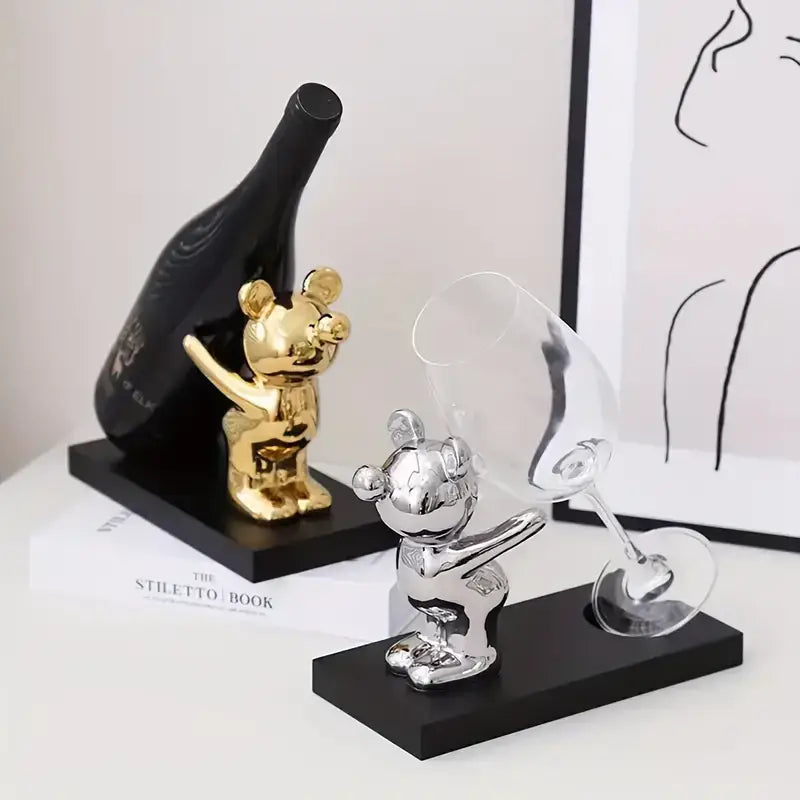 Gold and silver mickey mouse bear wine rack figurines holding wine bottles and glasses on black bases for kitchen decor