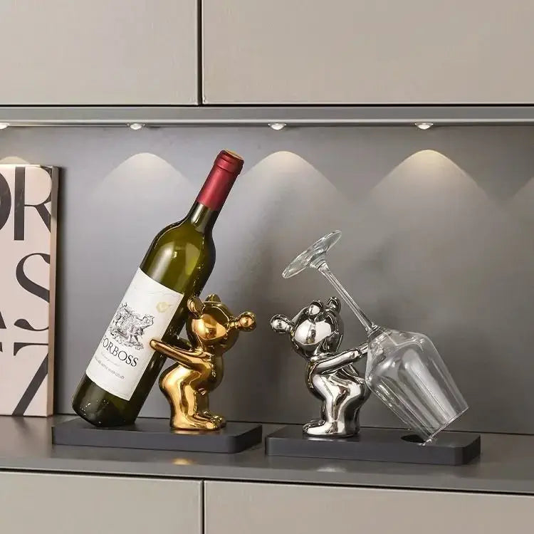 Silver and gold bear wine rack figurines holding bottles and glasses on sleek black bases for kitchen decor storage