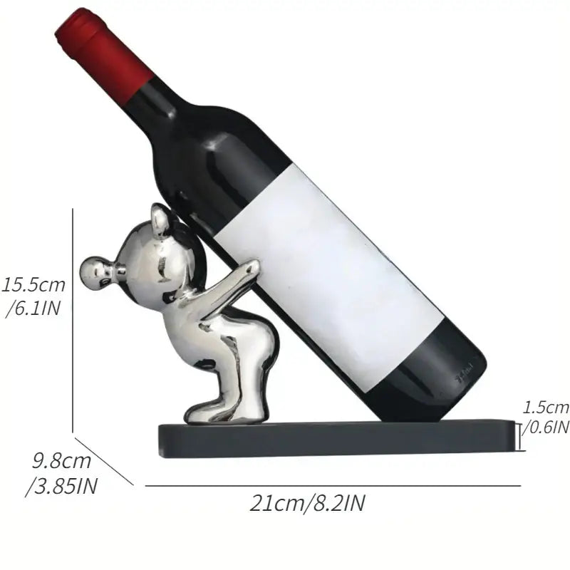 Silver and black bear wine rack featuring a shiny silver bear-shaped wine bottle holder with sleek minimalist design