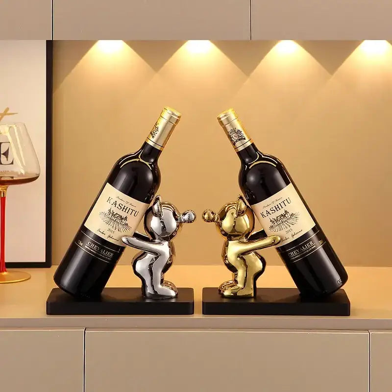 Silver and gold metallic bear wine rack holding kashitu wine bottles on black bases for kitchen decor storage